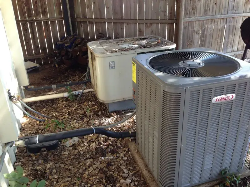 Lennox outdoor AC unit beside a home