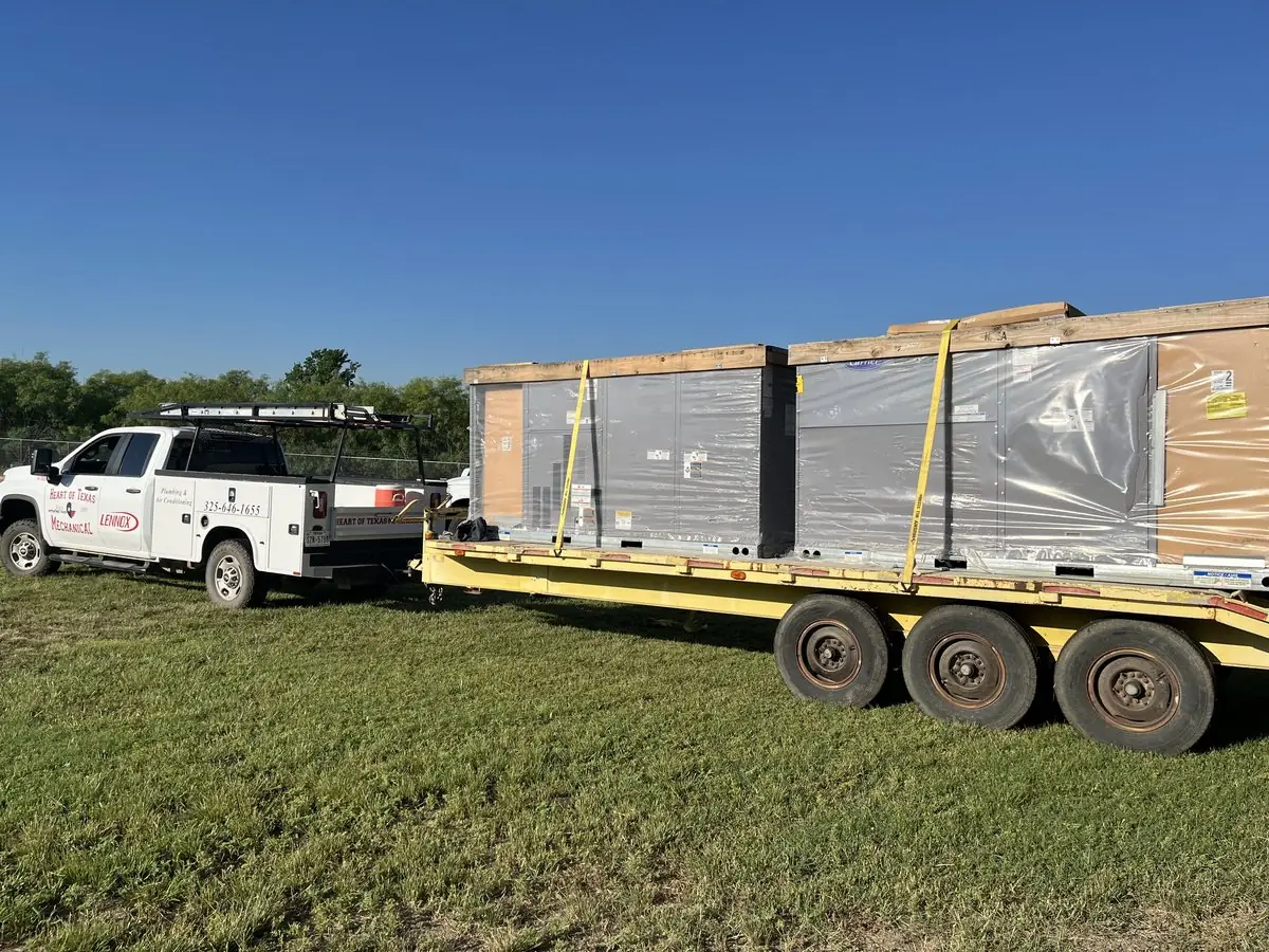 New rooftop HVAC units arriving on a trailer