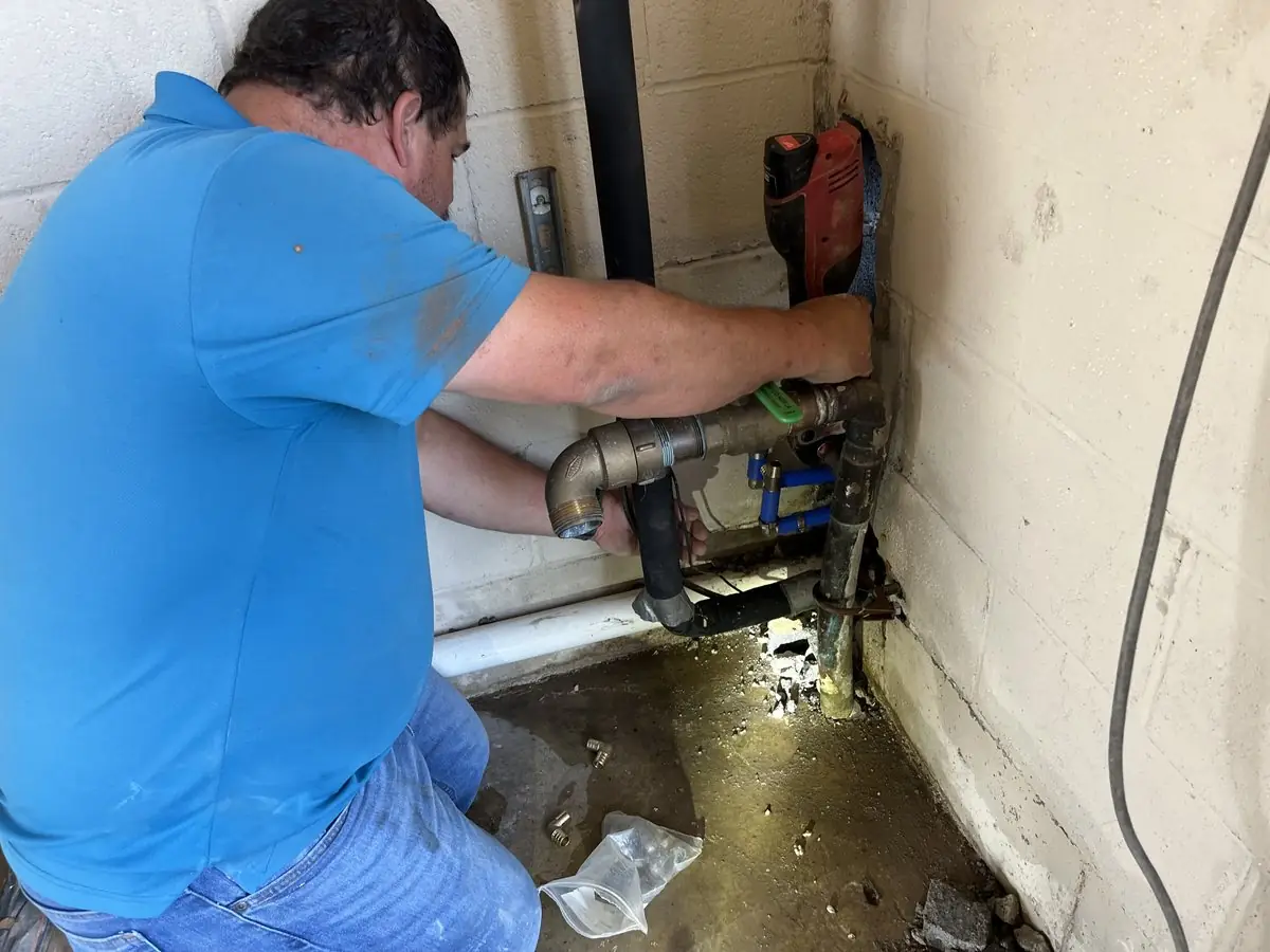 Technician repairing a water line